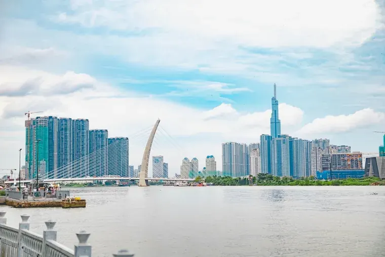 The Ba Son Bridge across the Saigon River, with the riverside towers and Landmark 81 behind it.