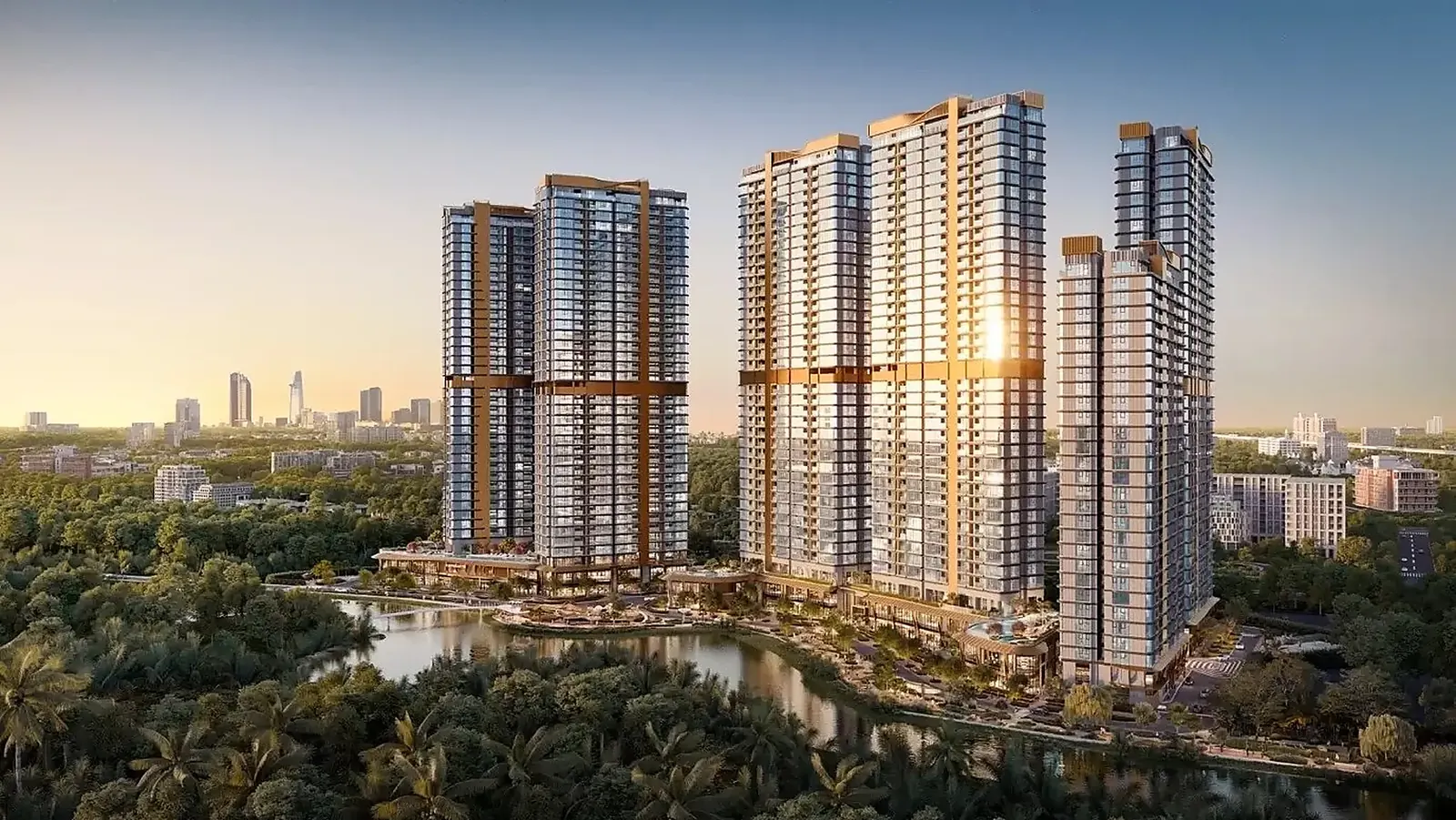 Eaton Park at sunset: the towers above the canal, with the Ho Chi Minh City skyline on the horizon.