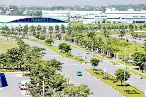 Landscaped boulevard and factory buildings inside Saigon Hi-Tech Park