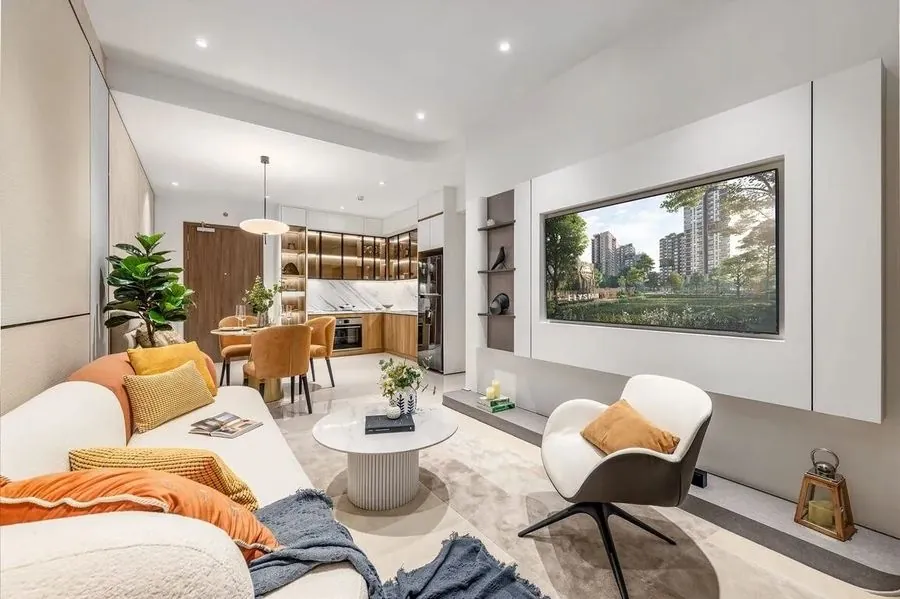 Elysian apartment interior: open living and dining area with the kitchen behind and a wide window onto the garden podium